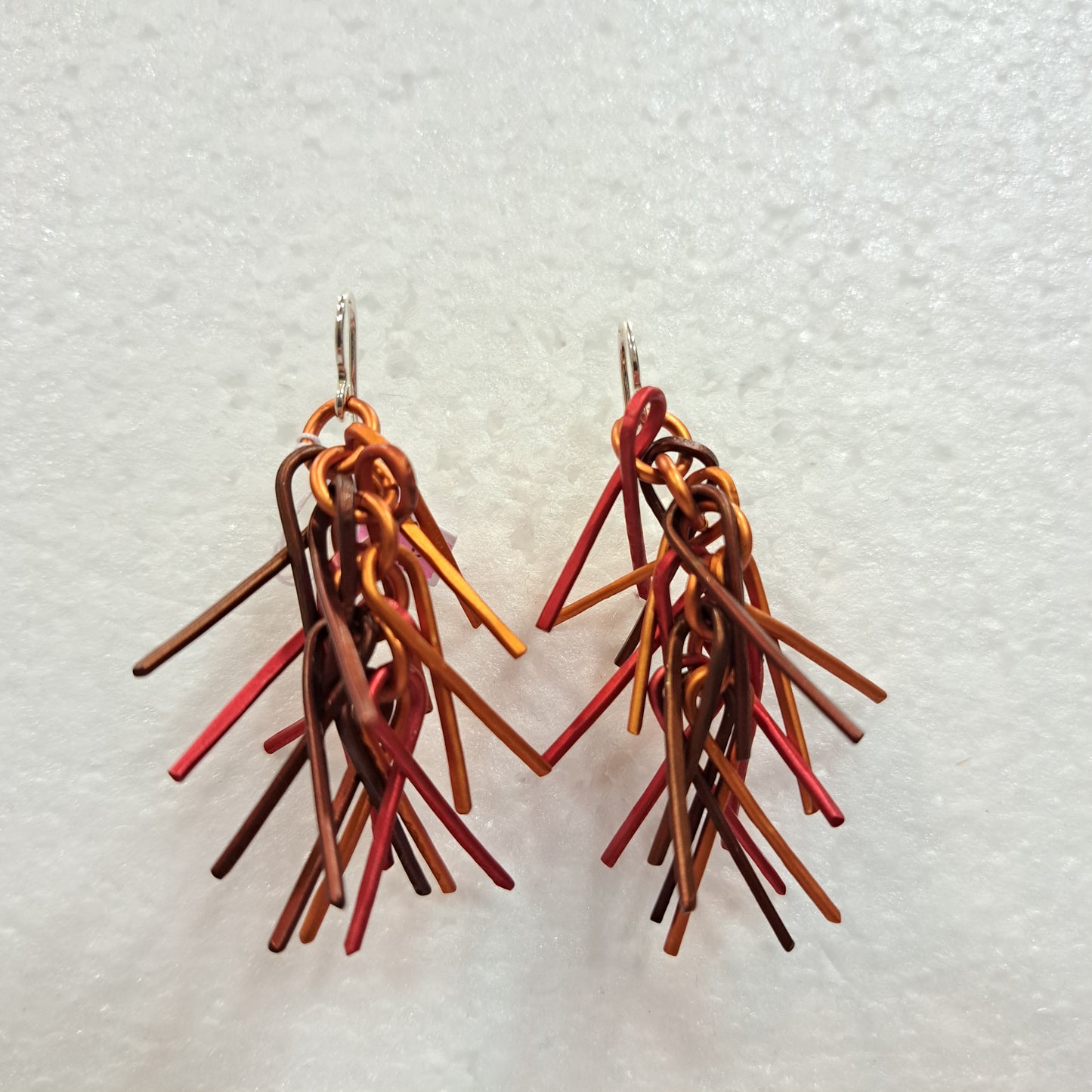 Boucles percées Trombones rouge, orange et cuivre OANA MILLET